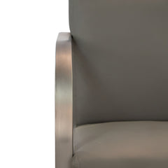 Close-up of the Karma Gosford salon chair showing the dark grey backrest and armrests