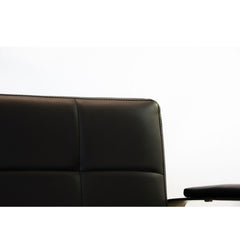 Close-up of the Karma Lithgow salon chair metallic armrest detail