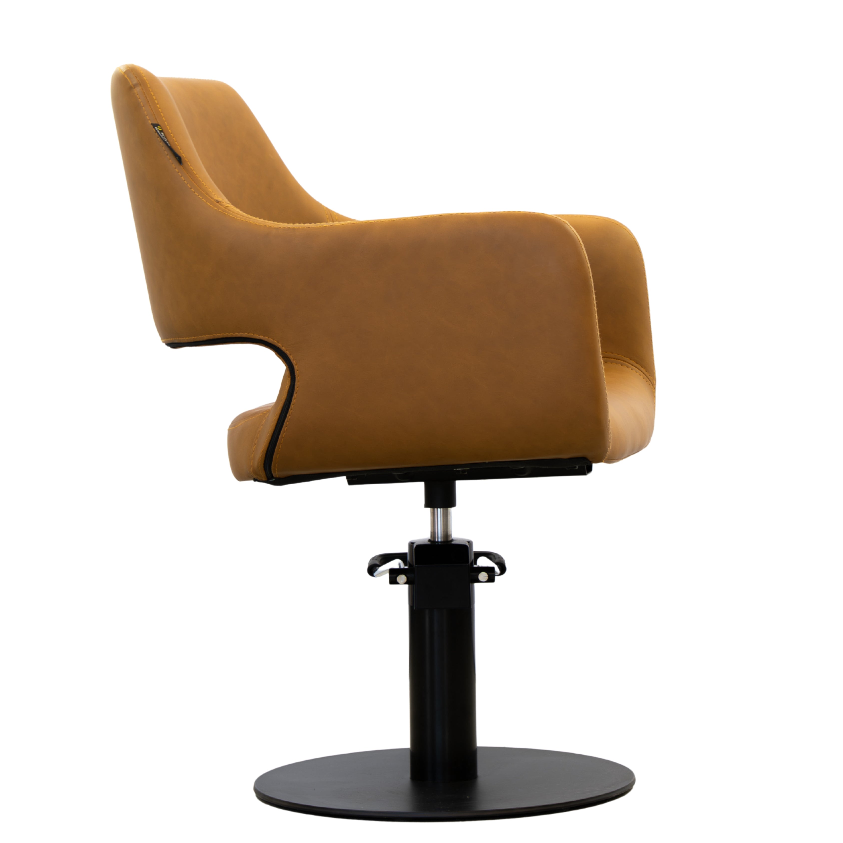 Alternate side view of the Karma Mudgee salon chair in tan showing the chair profile and hydraulic base